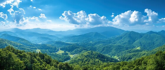 Serene vista of lush green mountains under a bright blue sky with fluffy white clouds panoramic view