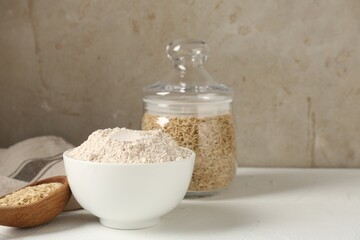 Brown rice and flour on white table