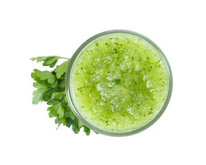 Healthy parsley smoothie in glass and leaves isolated on white, top view