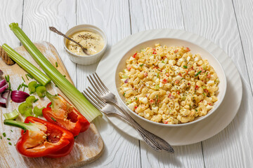 macaroni salad with celery, eggs, red bell pepper