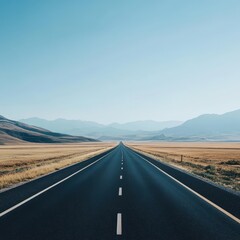 Expansive Open Road Through Scenic Natural Landscape Under Blue Sky