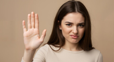 A woman with a repulsed expression and defensive gesture demonstrates strong disgust toward something unpleasant.