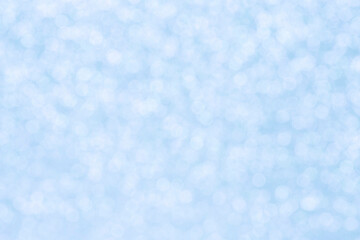 Christmas holiday backdrop: light blue bokeh background