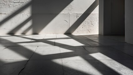 Obraz premium Abstract interplay of light and shadow on a white textured wall with diagonal black shadows cast by a window creating architectural depth.