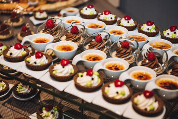 Creme Brulee and other small desserts on the festive table