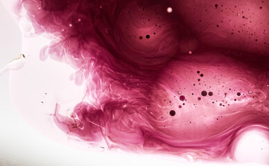 Dynamic abstraction of oil, milk and ink in warm red and pink tones. Smooth divorces and bubbles create the effect of magma or outer space. Futuristic design
