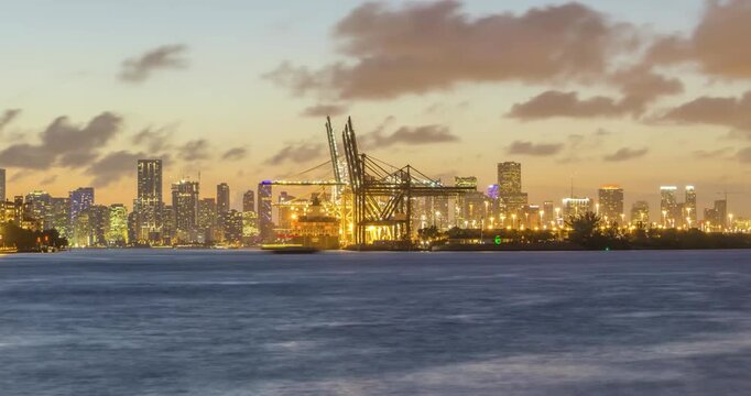Miami Port Docks and Miami Urban Beautiful Skyline in Evening. Time lapse of sunset over Port Miami city in Florida, USA