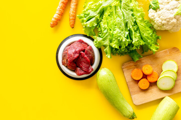 Cooking natural pet food with meat and vegetables, top view