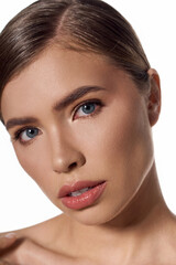 Fototapeta premium Young elegant woman showcasing beauty and style with captivating features in a minimalistic setting