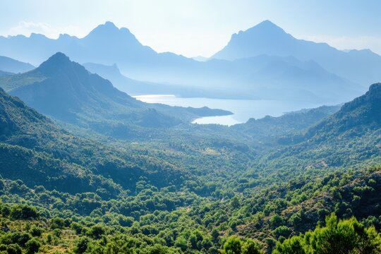 Serene mountain landscape with lush green valley and distant lake under a clear blue sky creating a peaceful and scenic vista - Powered by Adobe