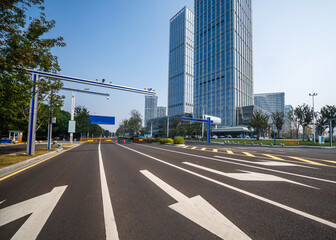 Modern Urban Street with Skyscrapers and Clear Blue Sky