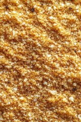 Golden brown sugar crystals close up texture background for baking and cooking ingredient concept with top view and natural light for culinary use