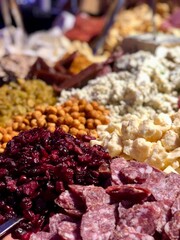 Charcuterie board with dried fruit, cheeses and meats 