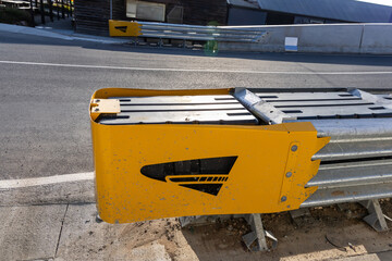 Crash cushion barrier at end of road barricade for safety. They absorb impact in the event of...