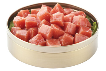 Fresh cubed tuna in a gold tin with greens, ready to serve