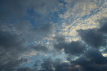 Serene white clouds drift across the azure sky, creating a sense of freedom and vastness. Symbolizes movement and travel.