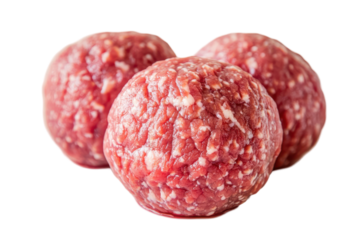 Freshly formed raw meatballs on a clean surface