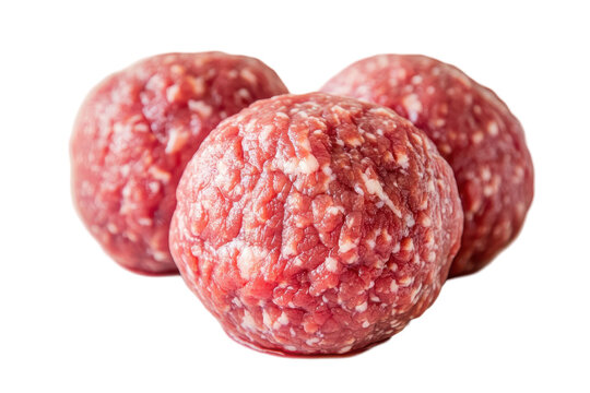 Freshly formed raw meatballs on a clean surface