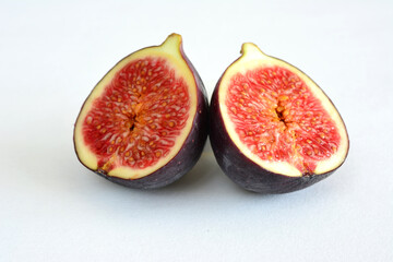 Close-up of a freshly cut fig, showing its vibrant red interior
