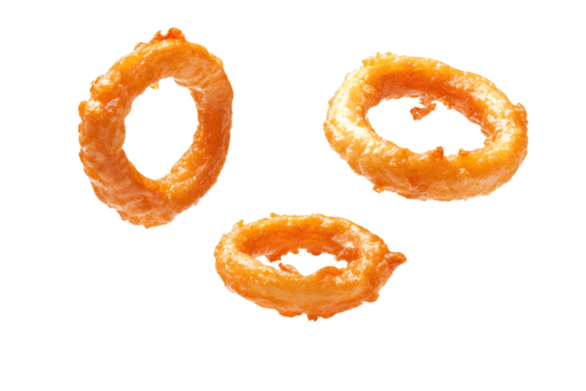 Fried crispy onion yellow gold amber rings floating in air isolated on cut out PNG or transparent background. Vegetables used cooking for appetizer food. Clipping path, full depth of field.