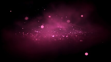 Delicate pink dust explosion on a dark backdrop conveying elegance and mystery