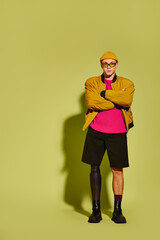 Modern fashion meets resilience with a stylish young man in studio setting
