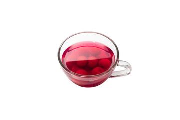 Sweet refreshing berry compote from ripe cherries in a glass isolated on white background.