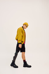 Handsome young man models trendy fashion with a stylish prosthetic leg