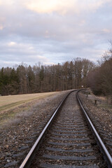 Fototapeta premium Curved Railway Tracks in Rural Landscape