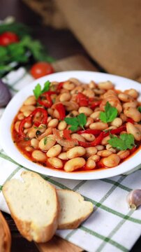 Lobio is a dish of Georgian, Azerbaijani and Armenian cuisines made from green bean pods. Traditional Georgian cuisine lobio. Lean dish. Lobio with pepper, onion.
