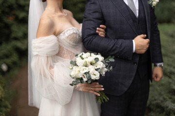 stylish beautiful newlywed couple in nature	