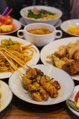 Indonesian satay, captured on March 17, 2025. Grilled skewered meat coated in rich spices and served with savory peanut sauce, creating a flavorful and authentic dish