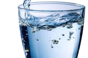 Crystal-clear water splashing in a glass, refreshing drink