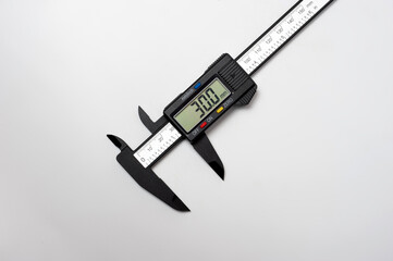 Electronic caliper with display photographed on a white background.
