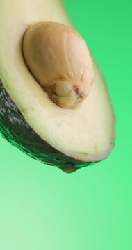 closeup of healthy avocado oil full of vitamins and nutrients pouring down from slice of avocado 