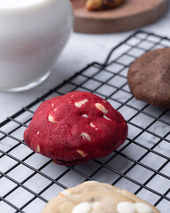 Assorted cookies over grid with milk