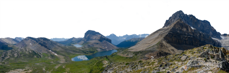Panorama of Rocky Mountain scene with small lake large mountain distant blue hills and transparent sky. Banff Canada
