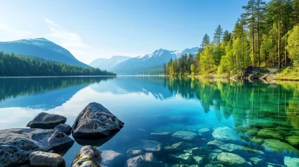 Huge lake that stretches to the mountains on the horizon. Green forests along the banks. Fluffy clouds are reflected in the crystal-clear water. Beautiful sunny day. Wallpaper, background, poster