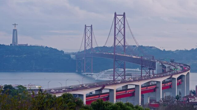 Bridge at sunset from Miradouro do Bairro do Alvito tourist viewpoint with Tagus river, traffic on 25th of April Bridge at sunset. Lisbon, Portugal. A cruise ship passes under a bridge. Timelapse