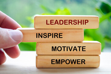 Leadership, Inspire, motive, empower text on wooden blocks. Leadership concept