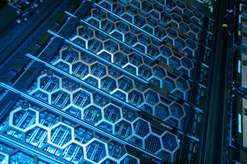 High-Tech Server Rack with Blue Lighting and Hexagonal Design Patterns