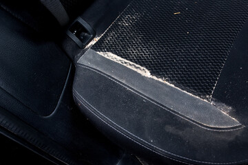 Car seat dusted with sand after a beach outing, ideal for automotive care, travel memories, and rugged lifestyle photography.