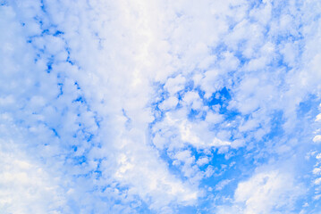 White clouds in a bright blue sky. The beauty of the nature