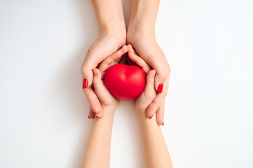Hands gently forming radiant red heart symbolizing altruism empathy and youth support on blank...
