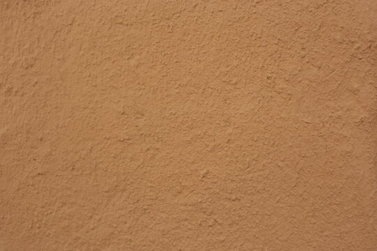 Soil wall texture of clay house structure. Mud background
