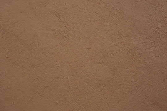 Soil wall texture of clay house structure. Mud background