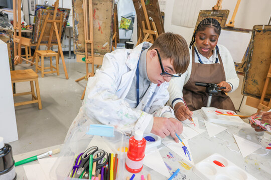 Disabled people in creative workshop