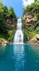 Fototapeta premium Majestic Waterfall Cascading into Tranquil Pool Lush Jungle Nature Photography Serene Environment Captivating Viewpoint