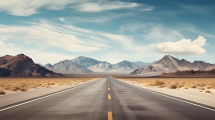 Naklejka premium Vast Desert Road with Majestic Mountain Backdrop Under Cloudy Sky