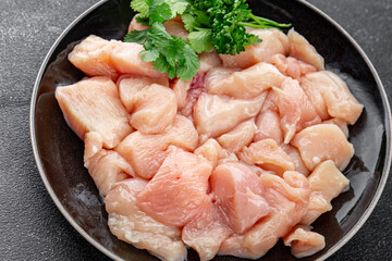 Chicken raw meat pieces of meat poultry tasty fresh delicious gourmet food background on table rustic food top view copy space keto and paleo diet